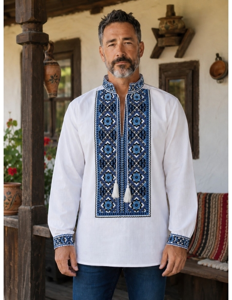 Barbat purtand camasa traditionala alba cu broderie geometrica albastra